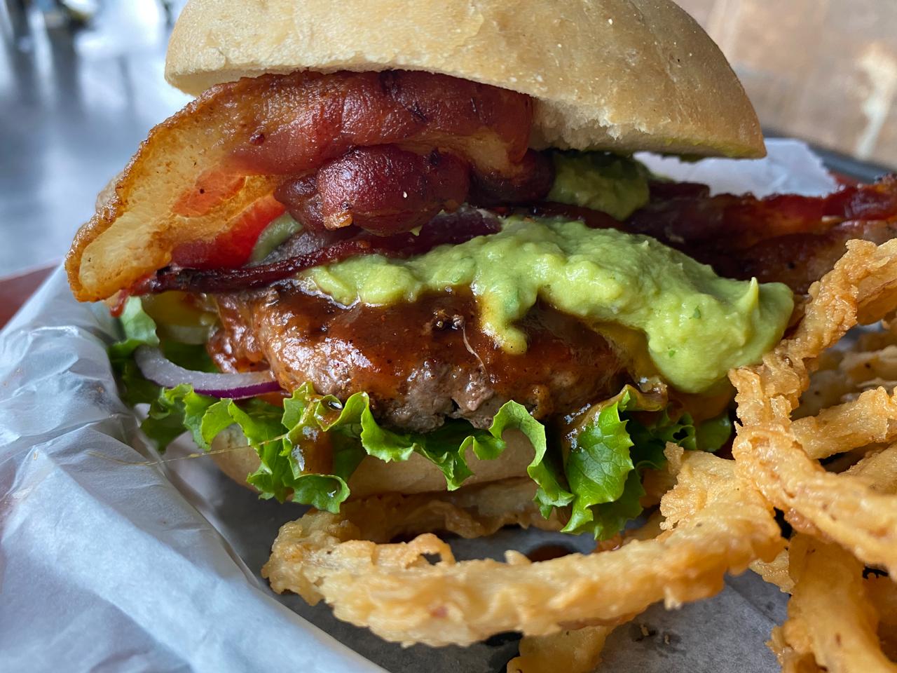 Tap House burger and beer on the bar